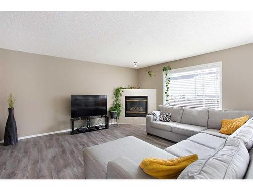 12 Panamount Crescent Nw, Calgary, AB - Indoor Photo Showing Living Room With Fireplace