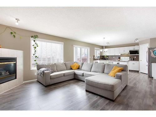 12 Panamount Crescent Nw, Calgary, AB - Indoor Photo Showing Living Room With Fireplace