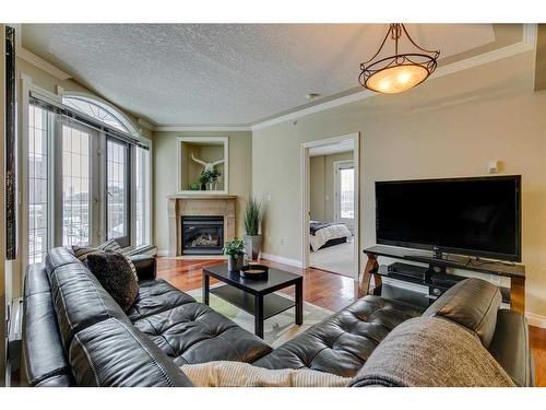 507-1315 12 Avenue Sw, Calgary, AB - Indoor Photo Showing Living Room With Fireplace