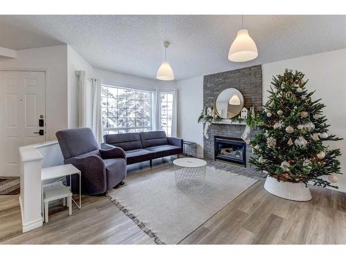 124 Harvest Park Way Ne, Calgary, AB - Indoor Photo Showing Living Room With Fireplace