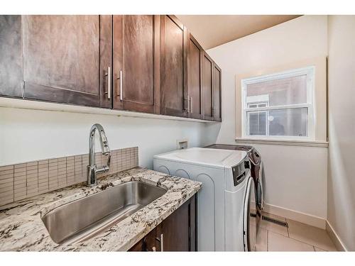 16 Rockcliff Point Nw, Calgary, AB - Indoor Photo Showing Laundry Room