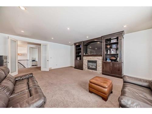 16 Rockcliff Point Nw, Calgary, AB - Indoor Photo Showing Living Room With Fireplace