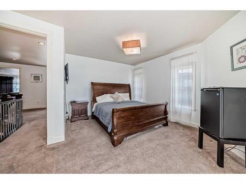 16 Rockcliff Point Nw, Calgary, AB - Indoor Photo Showing Bedroom