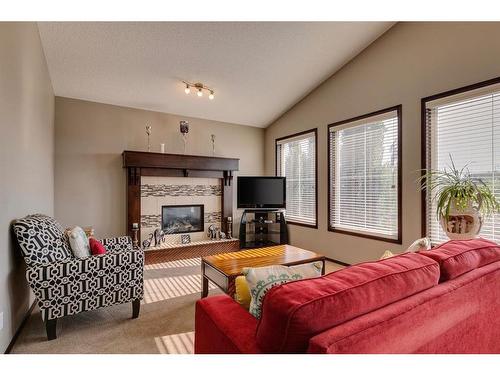 33 Evansview Manor Nw, Calgary, AB - Indoor Photo Showing Living Room With Fireplace