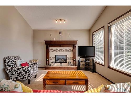 33 Evansview Manor Nw, Calgary, AB - Indoor Photo Showing Living Room With Fireplace