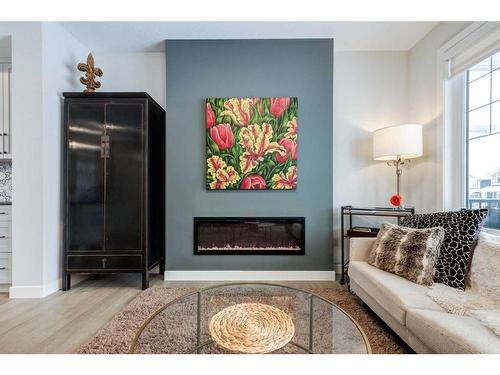 382 Sundown Road, Cochrane, AB - Indoor Photo Showing Living Room With Fireplace