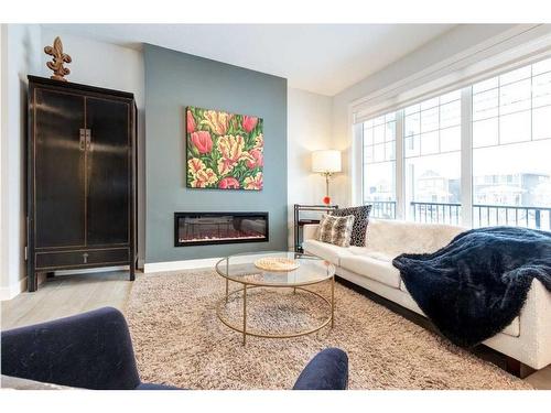 382 Sundown Road, Cochrane, AB - Indoor Photo Showing Living Room With Fireplace