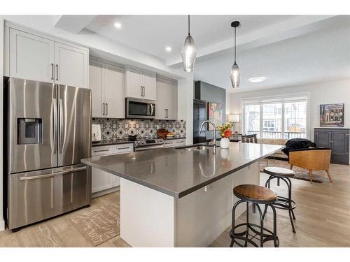 382 Sundown Road, Cochrane, AB - Indoor Photo Showing Kitchen With Upgraded Kitchen