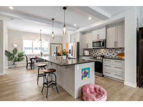 382 Sundown Road, Cochrane, AB - Indoor Photo Showing Kitchen With Double Sink With Upgraded Kitchen