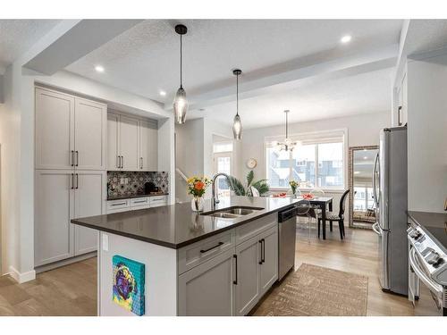 382 Sundown Road, Cochrane, AB - Indoor Photo Showing Kitchen With Double Sink With Upgraded Kitchen