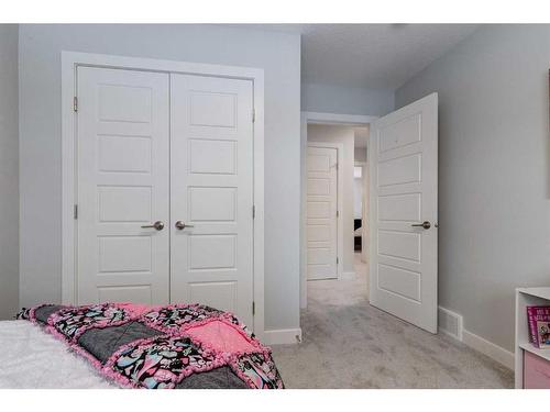 382 Sundown Road, Cochrane, AB - Indoor Photo Showing Bedroom