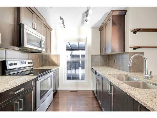 149 Walden Parade Se, Calgary, AB - Indoor Photo Showing Kitchen With Double Sink