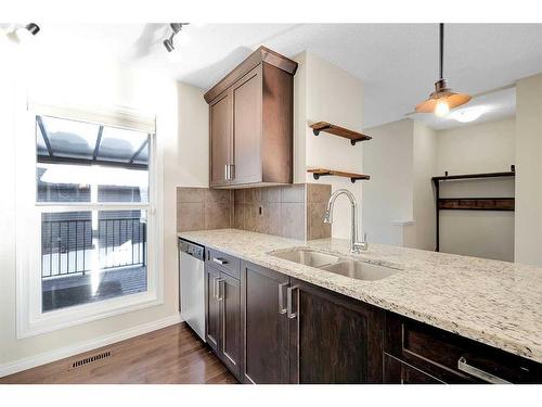 149 Walden Parade Se, Calgary, AB - Indoor Photo Showing Kitchen With Double Sink