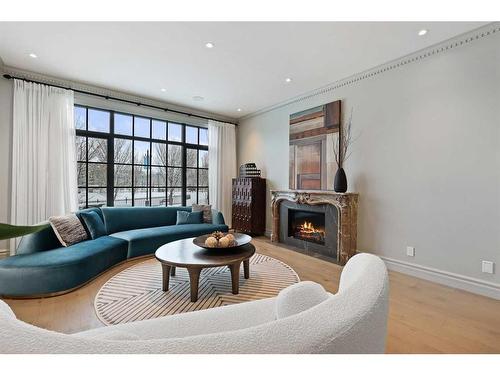 82 Valour Circle Sw, Calgary, AB - Indoor Photo Showing Living Room With Fireplace