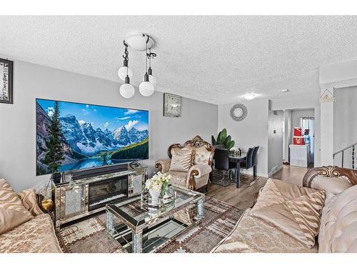 42 Templeby Way Ne, Calgary, AB - Indoor Photo Showing Living Room With Fireplace