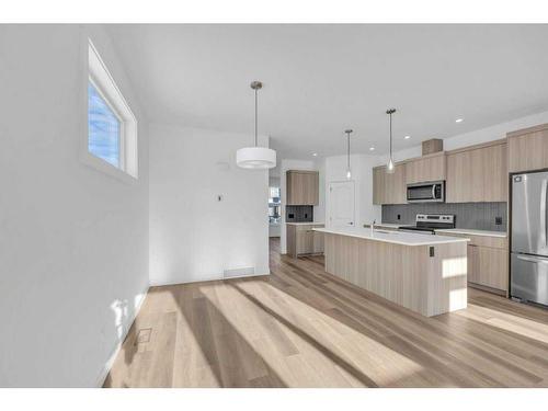 1115 Chinnok Winds Circle Sw, Airdrie, AB - Indoor Photo Showing Kitchen With Stainless Steel Kitchen