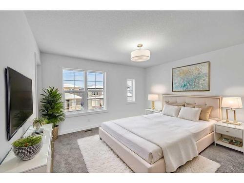 1115 Chinnok Winds Circle Sw, Airdrie, AB - Indoor Photo Showing Bedroom