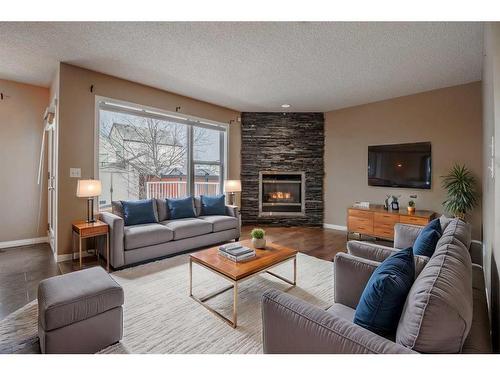 826 Copperfield Boulevard Se, Calgary, AB - Indoor Photo Showing Living Room With Fireplace