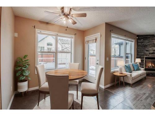 826 Copperfield Boulevard Se, Calgary, AB - Indoor Photo Showing Dining Room With Fireplace