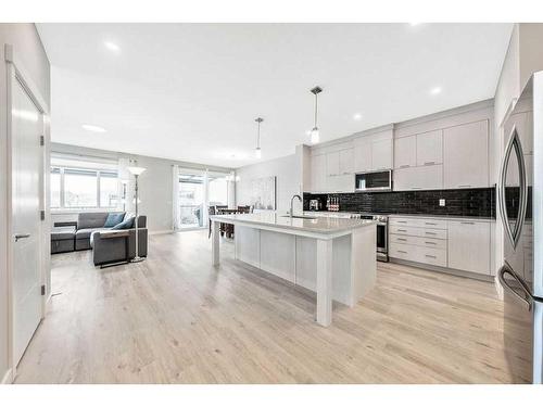 11 Willow Park Point, Cochrane, AB - Indoor Photo Showing Kitchen With Upgraded Kitchen