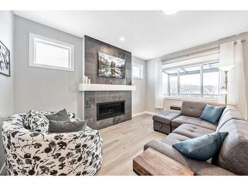 11 Willow Park Point, Cochrane, AB - Indoor Photo Showing Living Room With Fireplace