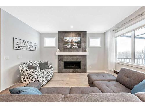 11 Willow Park Point, Cochrane, AB - Indoor Photo Showing Living Room With Fireplace