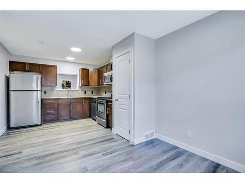 151 Panatella Road Nw, Calgary, AB - Indoor Photo Showing Kitchen