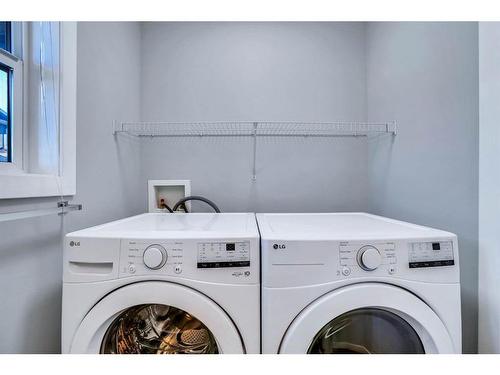 151 Panatella Road Nw, Calgary, AB - Indoor Photo Showing Laundry Room