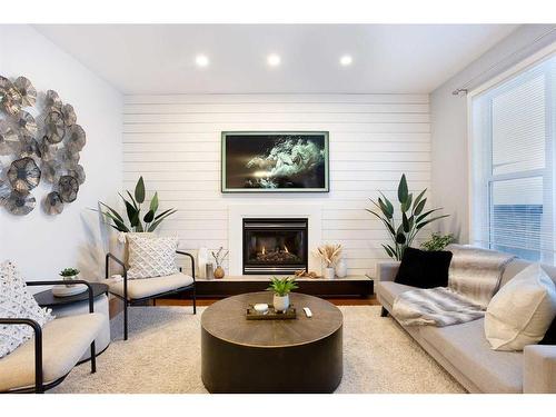 14 Copperstone Drive Se, Calgary, AB - Indoor Photo Showing Living Room With Fireplace