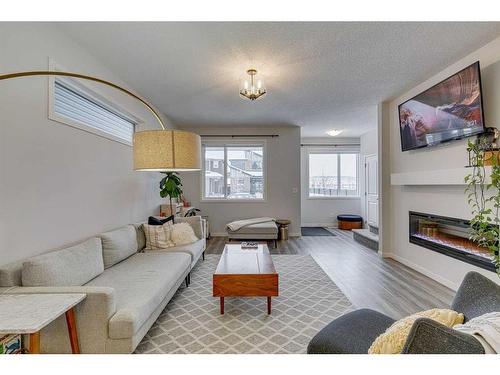 132 Wolf Creek Manor Se, Calgary, AB - Indoor Photo Showing Living Room With Fireplace