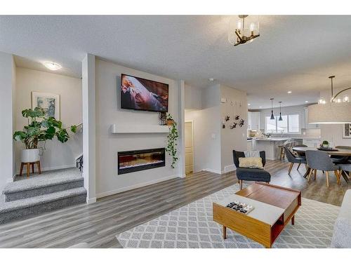 132 Wolf Creek Manor Se, Calgary, AB - Indoor Photo Showing Living Room With Fireplace