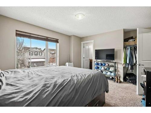 163 Chapalina Square Se, Calgary, AB - Indoor Photo Showing Bedroom