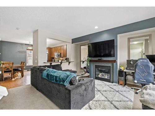 163 Chapalina Square Se, Calgary, AB - Indoor Photo Showing Living Room With Fireplace