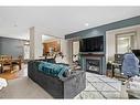 163 Chapalina Square Se, Calgary, AB  - Indoor Photo Showing Living Room With Fireplace 