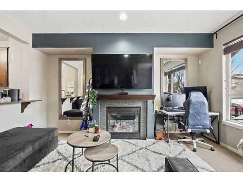 163 Chapalina Square Se, Calgary, AB - Indoor Photo Showing Living Room With Fireplace