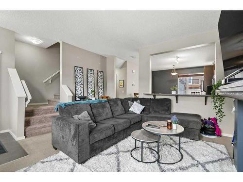 163 Chapalina Square Se, Calgary, AB - Indoor Photo Showing Living Room