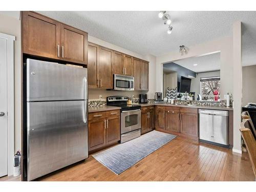 163 Chapalina Square Se, Calgary, AB - Indoor Photo Showing Kitchen With Double Sink