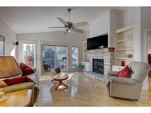 355 New Brighton Place Se, Calgary, AB - Indoor Photo Showing Living Room With Fireplace