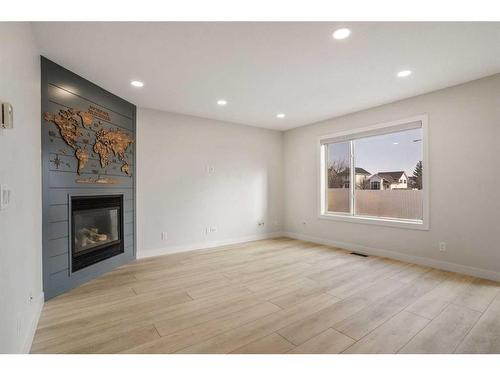 276 Royal Birch Circle Nw, Calgary, AB - Indoor Photo Showing Other Room With Fireplace