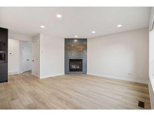 276 Royal Birch Circle Nw, Calgary, AB - Indoor Photo Showing Living Room With Fireplace