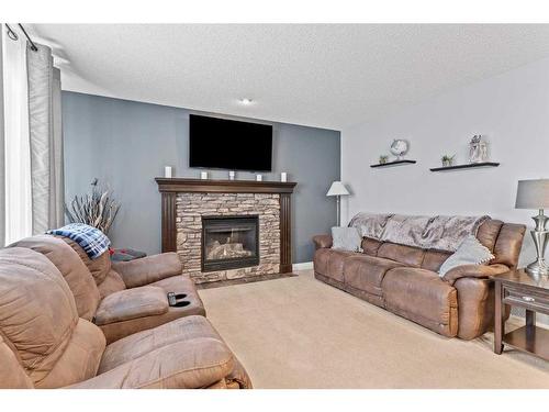 1712 High Park Boulevard Nw, High River, AB - Indoor Photo Showing Living Room With Fireplace