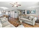 25 Millbank Bay Sw, Calgary, AB  - Indoor Photo Showing Living Room 