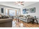 25 Millbank Bay Sw, Calgary, AB  - Indoor Photo Showing Living Room 