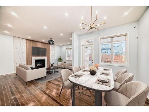 8 Sage Valley Close Nw, Calgary, AB - Indoor Photo Showing Dining Room With Fireplace