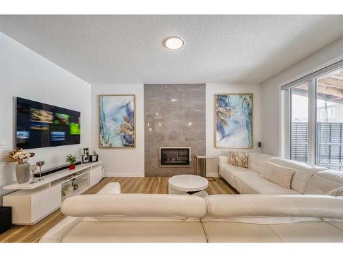 41 Evansfield Manor Nw, Calgary, AB - Indoor Photo Showing Living Room With Fireplace