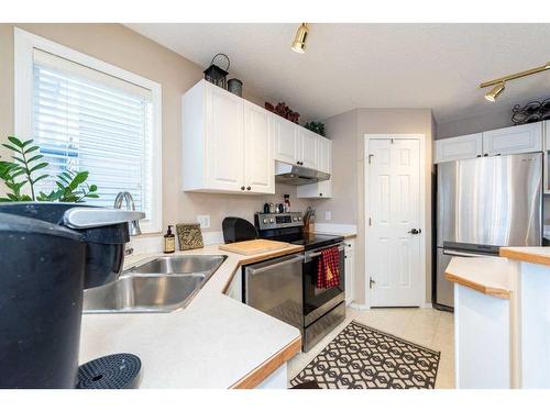 215 Chapalina Place Se, Calgary, AB - Indoor Photo Showing Kitchen With Double Sink