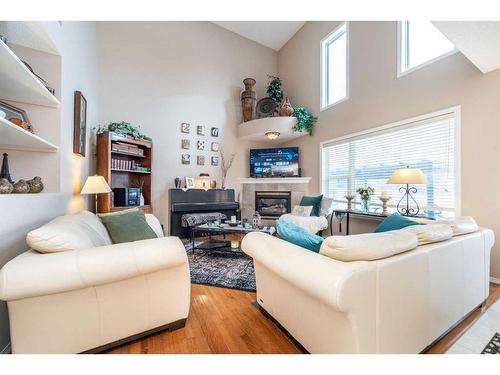 215 Chapalina Place Se, Calgary, AB - Indoor Photo Showing Living Room With Fireplace