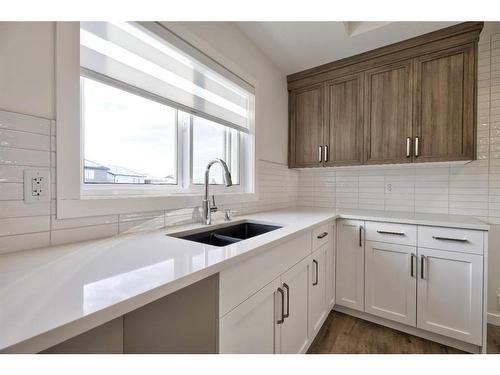 123 Legacy Reach Court Se, Calgary, AB - Indoor Photo Showing Kitchen With Double Sink With Upgraded Kitchen