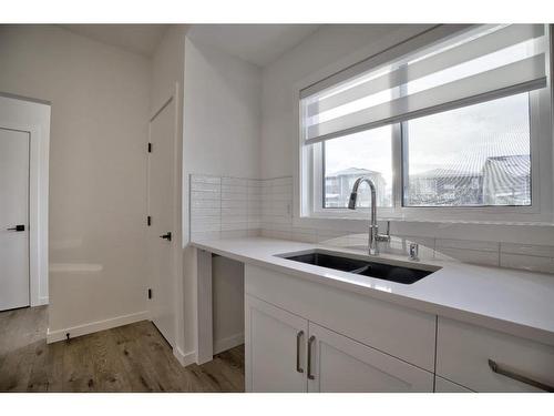 123 Legacy Reach Court Se, Calgary, AB - Indoor Photo Showing Kitchen With Double Sink