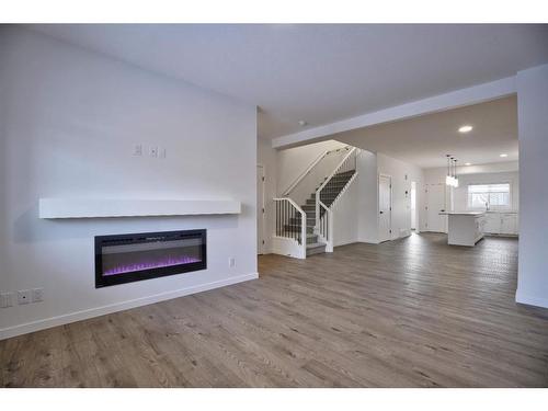 123 Legacy Reach Court Se, Calgary, AB - Indoor Photo Showing Living Room With Fireplace